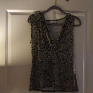 Black white and brown sleeveless low cut blouse